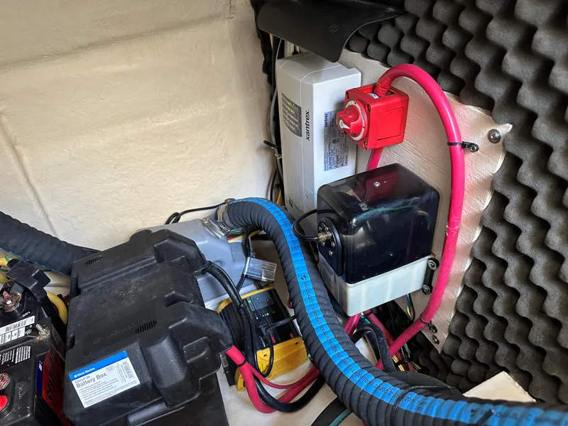 Slide: The Image of Electrical components and battery box in a 2012 Bayliner 335 Cruiser boat. - 20