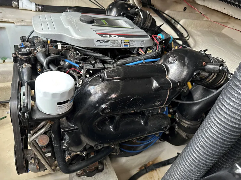 Slide: The Image of 2012 Bayliner 335 Cruiser engine compartment with Mercury MerCruiser 5.0L engine. - 27