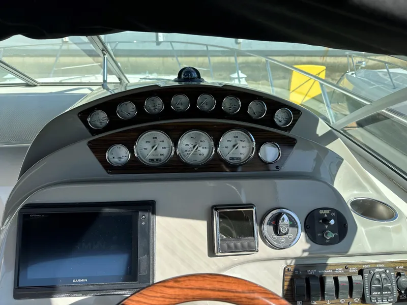 Slide: The Image of 2012 Bayliner 335 Cruiser helm with gauges and Garmin GPS - 4
