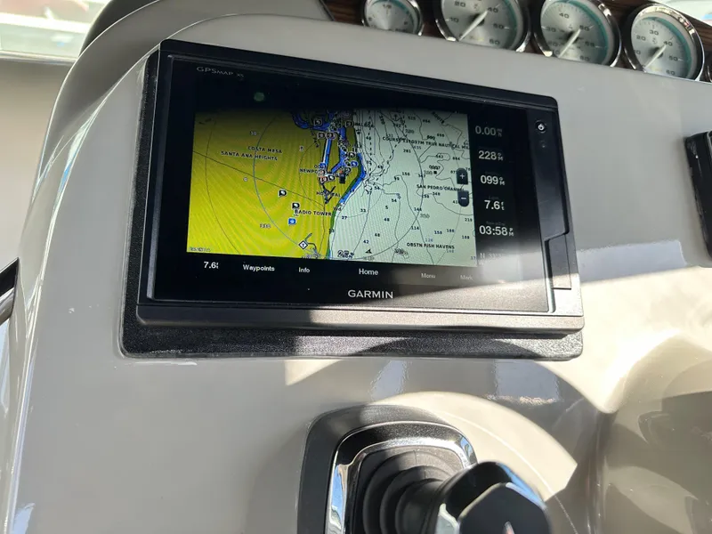Slide: The Image of Garmin GPS navigation system on 2012 Bayliner 335 Cruiser dashboard. - 7
