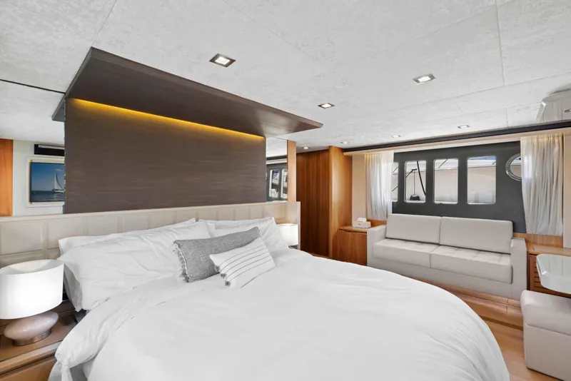 Slide: The Image of Luxurious bedroom interior on 2015 Absolute 64 FLY yacht with modern design and cozy seating. - 10