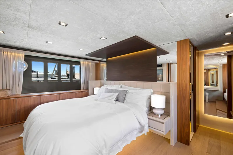 Slide: The Image of Luxurious bedroom interior of 2015 Absolute 64 FLY yacht with modern design and large windows. - 11