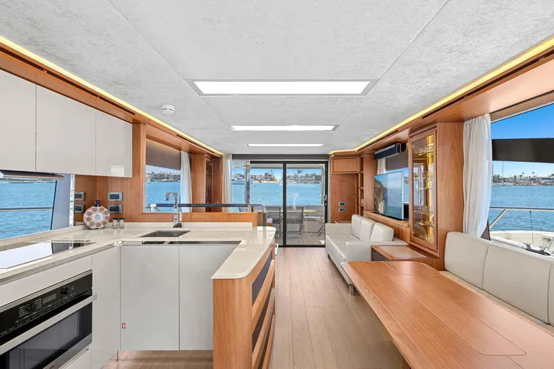 Slide: The Image of Luxurious interior of 2015 Absolute 64 FLY yacht with modern kitchen and seating area. - 14