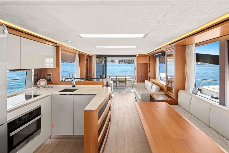 Slide: The Image of Luxurious interior of 2015 Absolute 64 FLY yacht with modern kitchen and dining area. - 17
