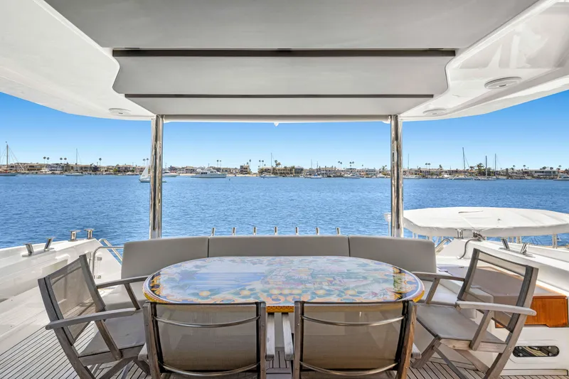 Slide: The Image of Luxury yacht Absolute 64 FLY 2015, featuring elegant outdoor dining area with ocean view. - 18