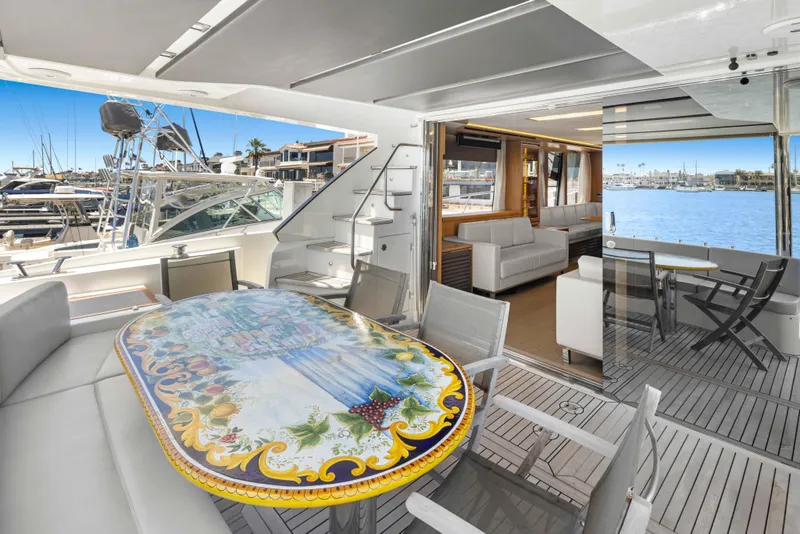 Slide: The Image of Luxurious 2015 Absolute 64 FLY yacht interior with elegant dining area and marina view. - 19