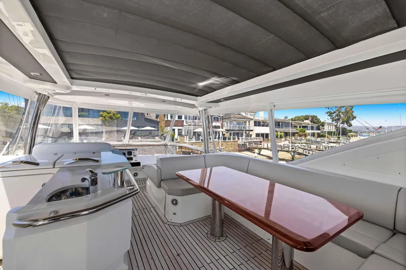 Slide: The Image of Luxurious 2015 Absolute 64 FLY yacht interior with sleek seating and elegant dining area. - 21
