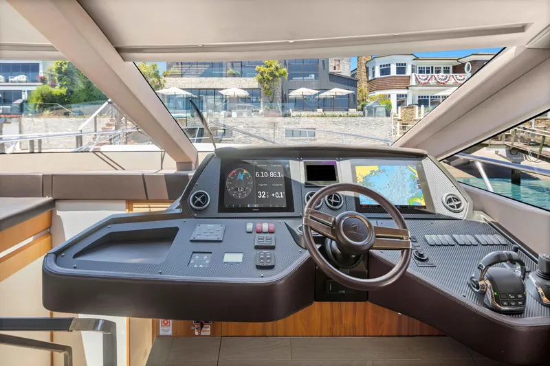 Slide: The Image of Cockpit of 2015 Absolute 64 FLY yacht with modern navigation controls and steering wheel. - 28