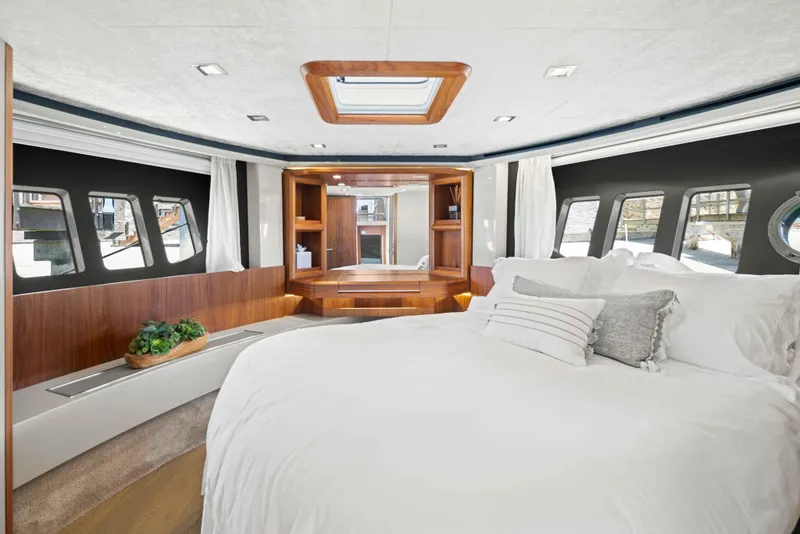 Slide: The Image of Luxurious bedroom interior of 2015 Absolute 64 FLY yacht with modern design and large windows. - 29