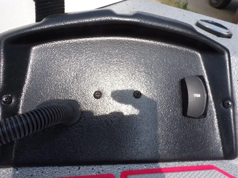 Slide: The Image of Control panel of a 2024 Xpress H190Bay boat with trim switch. - 15