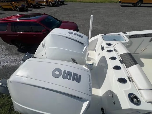 Slide: The Image of 2022 Wellcraft 262 Fisherman boat with dual Mercury outboard engines. - 4