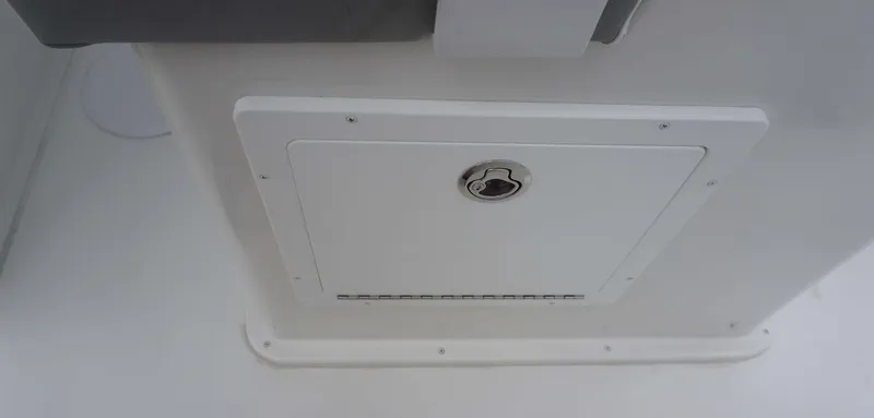 Slide: The Image of Hatch door on a 2025 Parker 2400 CC boat, featuring a secure lock mechanism. - 15