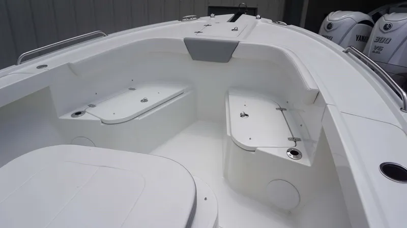 Slide: The Image of 2025 Parker 2400 CC boat interior with storage compartments and seating. - 3