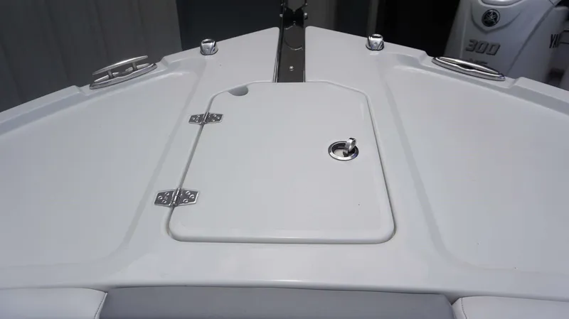 Slide: The Image of Bow deck of 2025 Parker 2400 CC boat with storage hatch and cleats. - 6