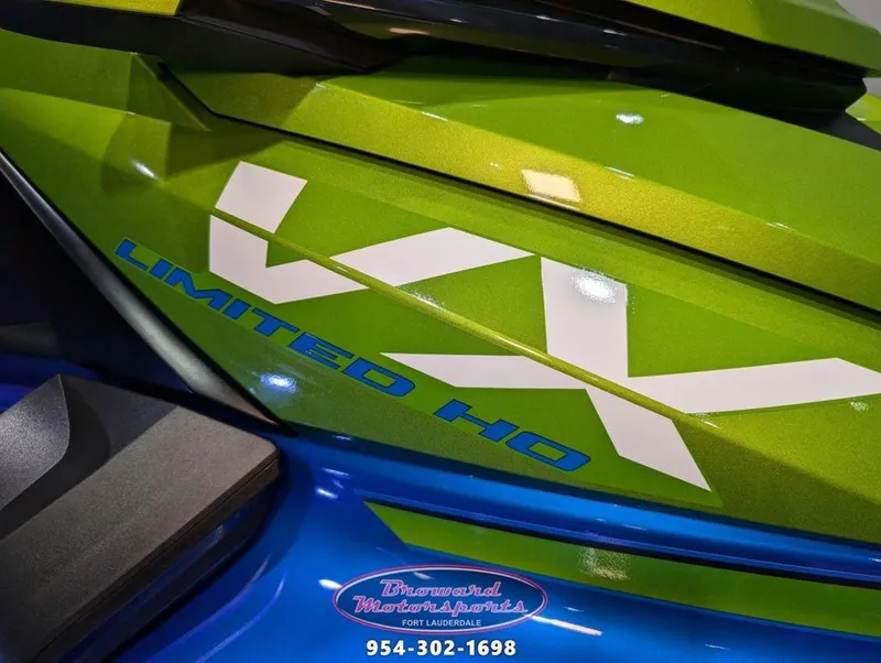 Slide: The Image of 2024 Yamaha Boats VX® Limited HO in vibrant green and blue design. - 11