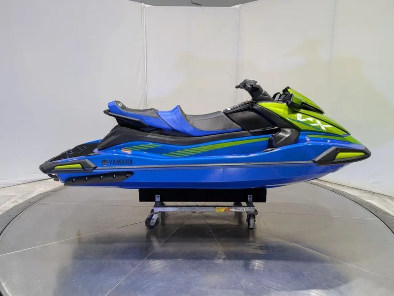Slide: The Image of 2024 Yamaha Boats VX® Limited HO in blue and green, displayed on a stand. - 27