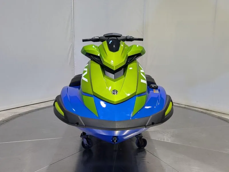 Slide: The Image of 2024 Yamaha Boats VX® Limited HO in vibrant green and blue, front view. - 29