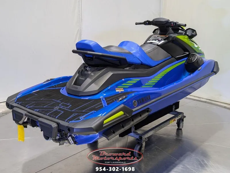 Slide: The Image of 2024 Yamaha Boats VX® Limited HO in blue and green on display stand. - 7
