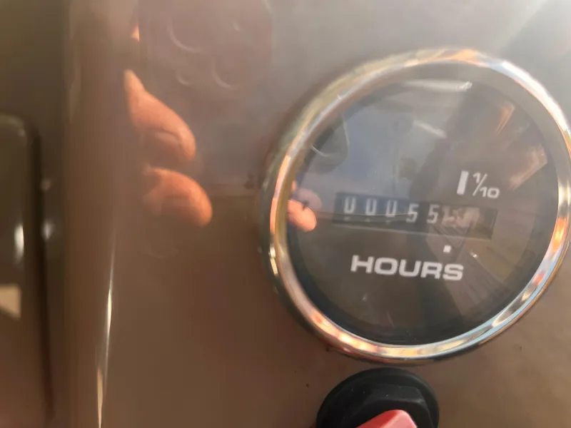 Slide: The Image of Hour meter on a 2019 Sun Tracker Fishin' Barge 24 DLX showing 55.1 hours. - 26