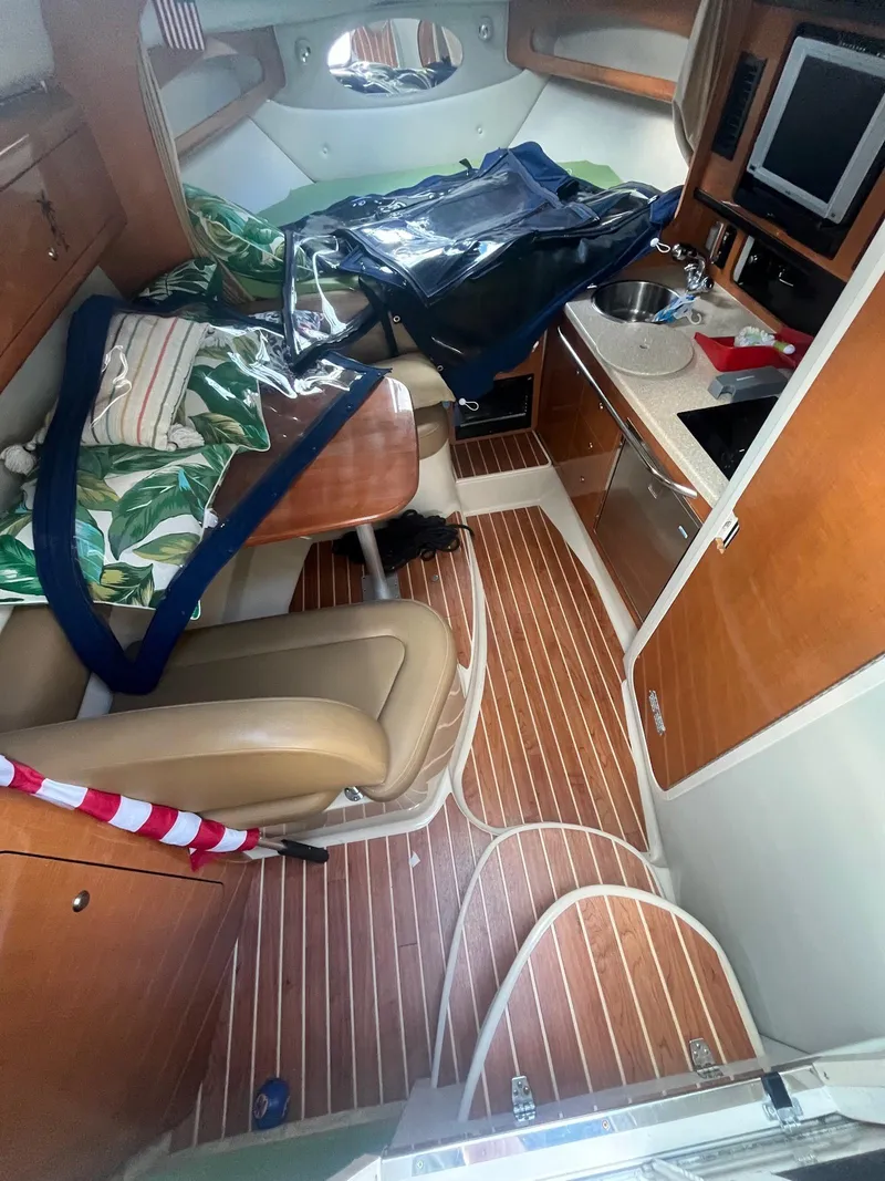 Slide: The Image of 2007 Chaparral Signature 280 cabin interior with wood flooring and kitchenette. - 11