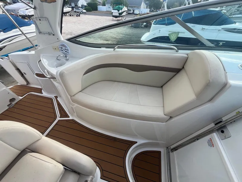Slide: The Image of 2007 Chaparral Signature 280 boat interior with white and beige seating. - 7