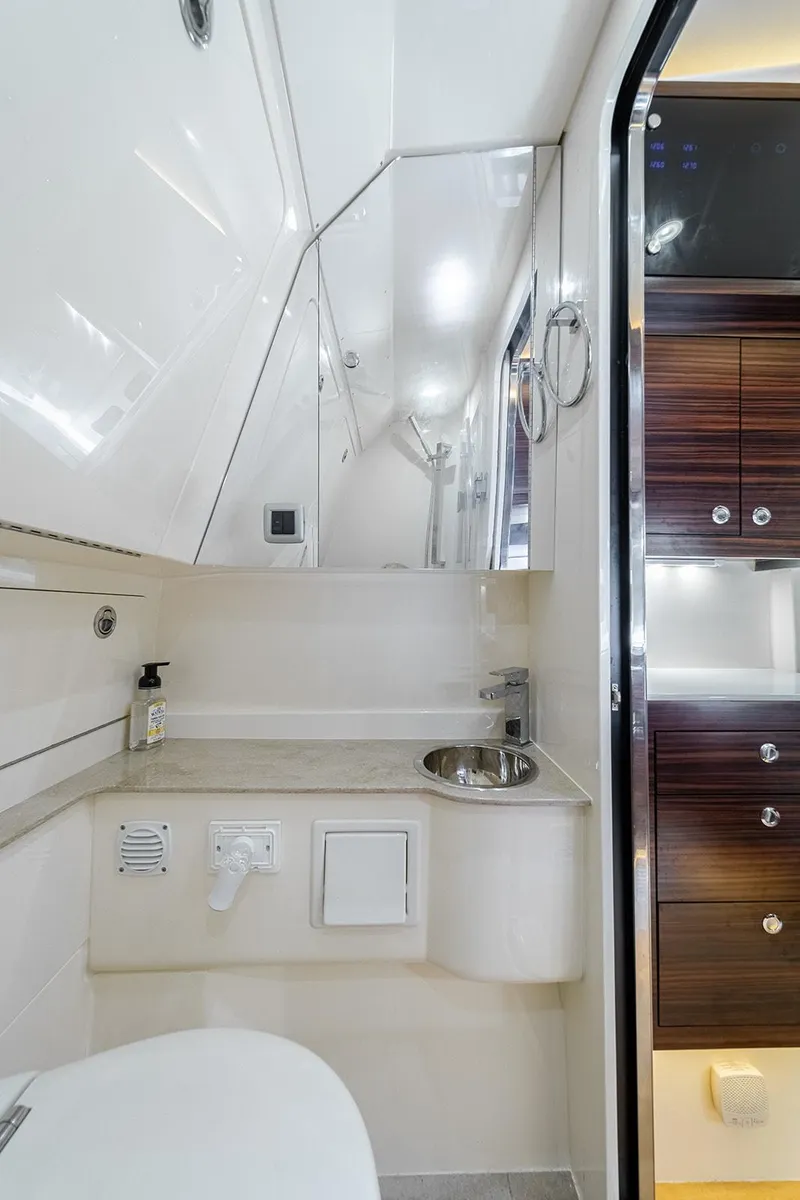 Slide: The Image of 2020 Scout 420 LXF yacht bathroom interior with modern fixtures and sleek design. - 13