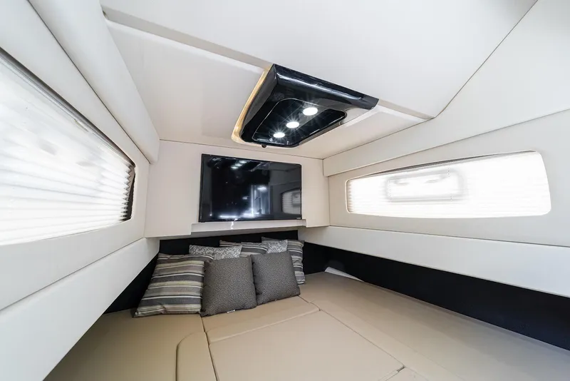 Slide: The Image of Luxurious interior cabin of 2020 Scout 420 LXF boat with modern design and comfortable seating. - 14