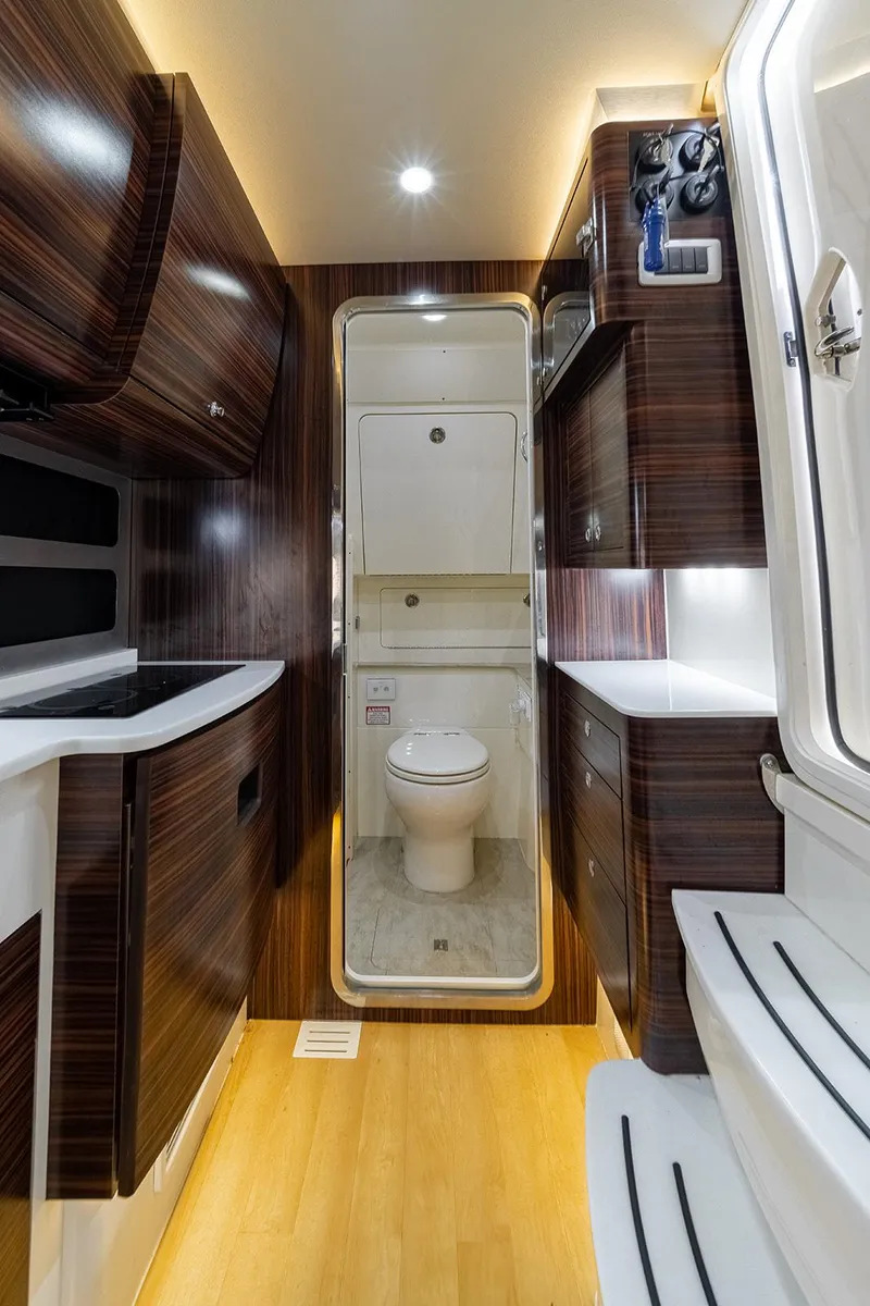 Slide: The Image of Luxurious interior of 2020 Scout 420 LXF yacht featuring modern bathroom amenities. - 16