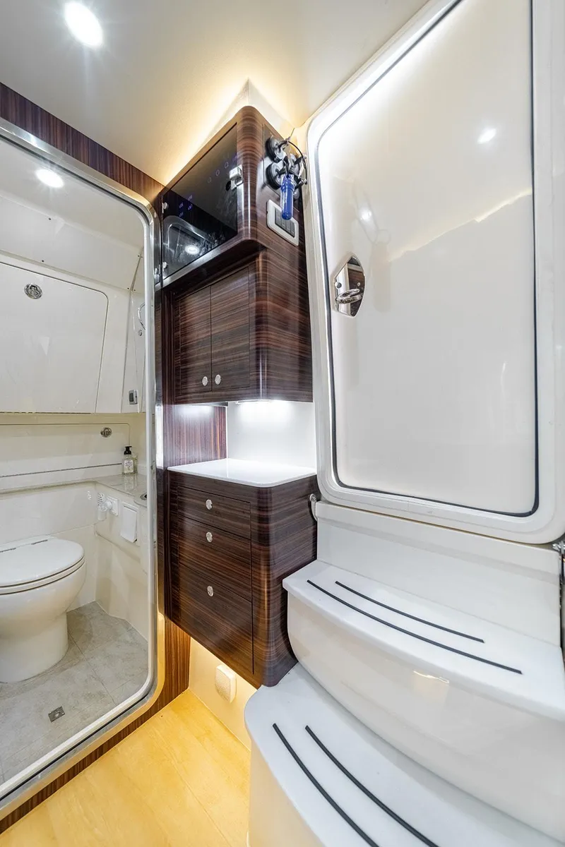 Slide: The Image of Luxurious interior of 2020 Scout 420 LXF yacht bathroom with modern amenities. - 19