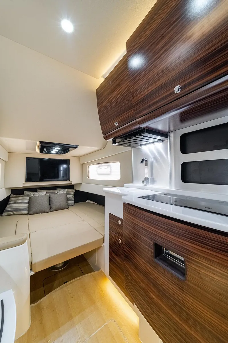 Slide: The Image of 2020 Scout 420 LXF interior with modern kitchen and cozy seating area. - 24