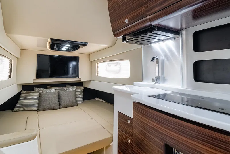 Slide: The Image of Luxurious interior of 2020 Scout 420 LXF yacht with modern kitchen and cozy seating area. - 25