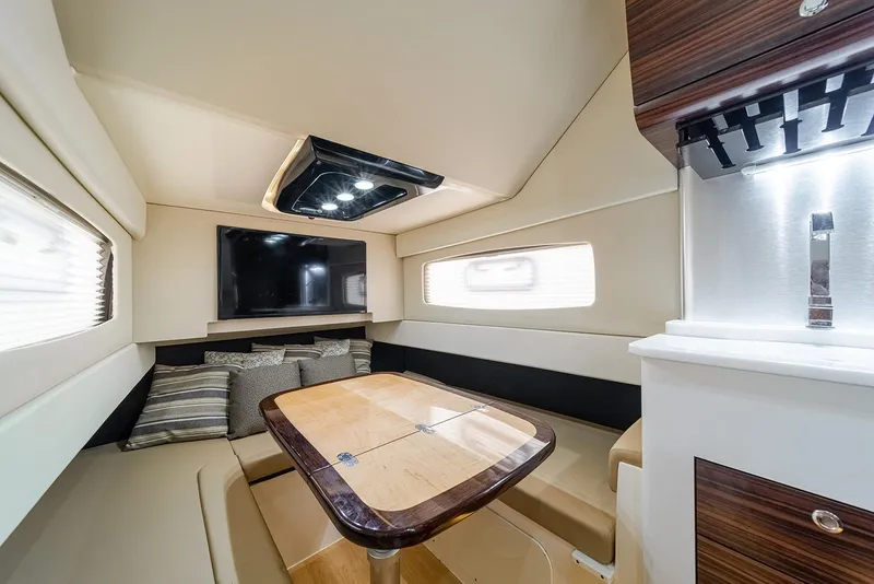 Slide: The Image of Luxurious interior of 2020 Scout 420 LXF boat with seating and modern amenities. - 27