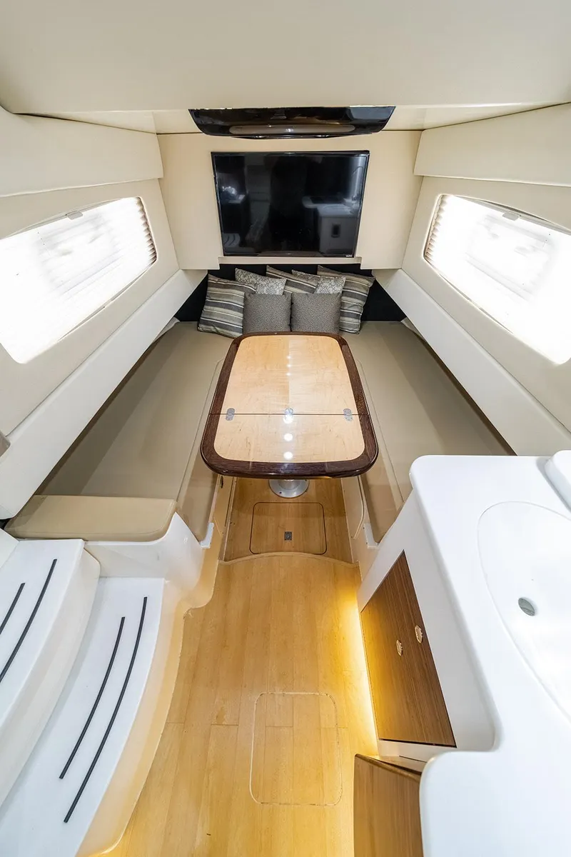Slide: The Image of 2020 Scout 420 LXF interior with elegant seating, table, and modern amenities. - 30