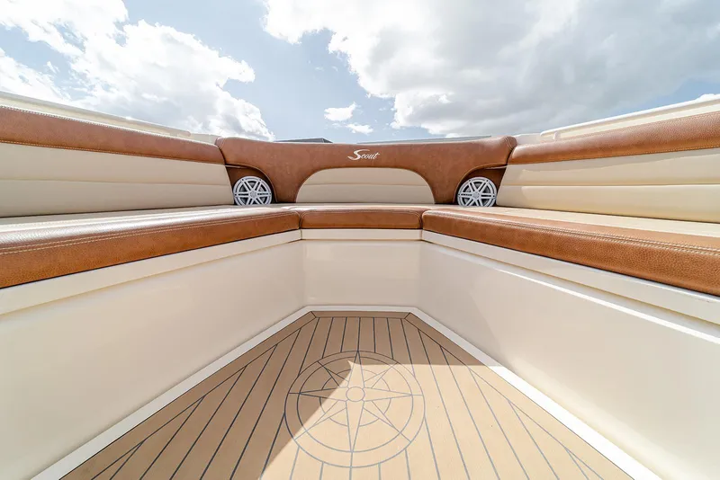 Slide: The Image of Luxurious interior of 2020 Scout 420 LXF boat with brown leather seating. - 41