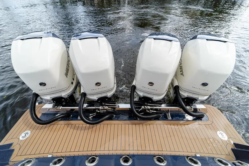 Slide: The Image of 2020 Scout 420 LXF boat with four powerful outboard engines on water. - 45