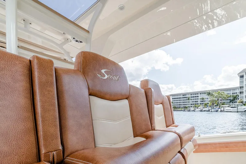 Slide: The Image of Luxurious seating on 2020 Scout 420 LXF boat with waterfront view. - 49