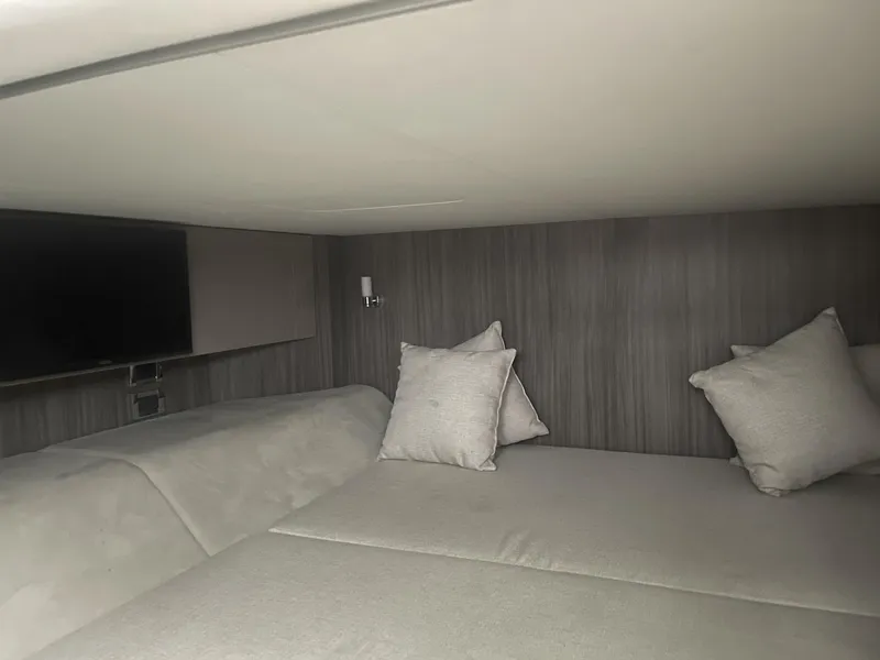 Slide: The Image of Interior cabin of 2022 Sea Ray SLX 400 with cozy bedding and modern decor. - 10