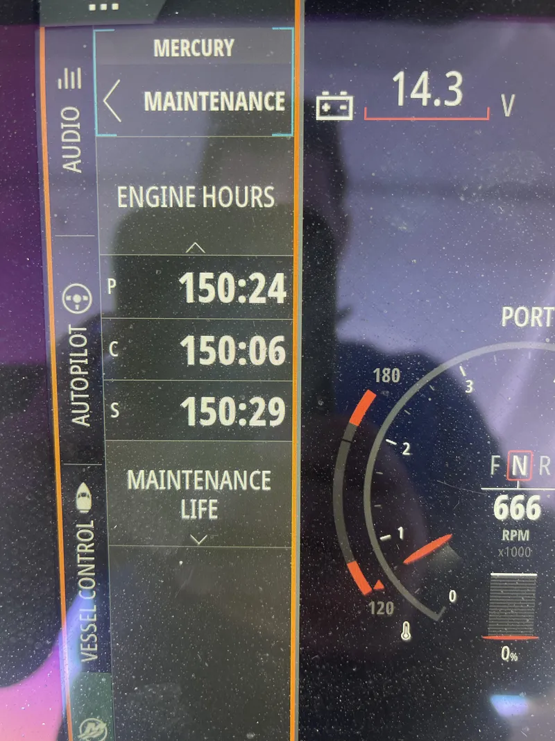Slide: The Image of 2022 Sea Ray SLX 400 dashboard displaying engine hours and maintenance information. - 18