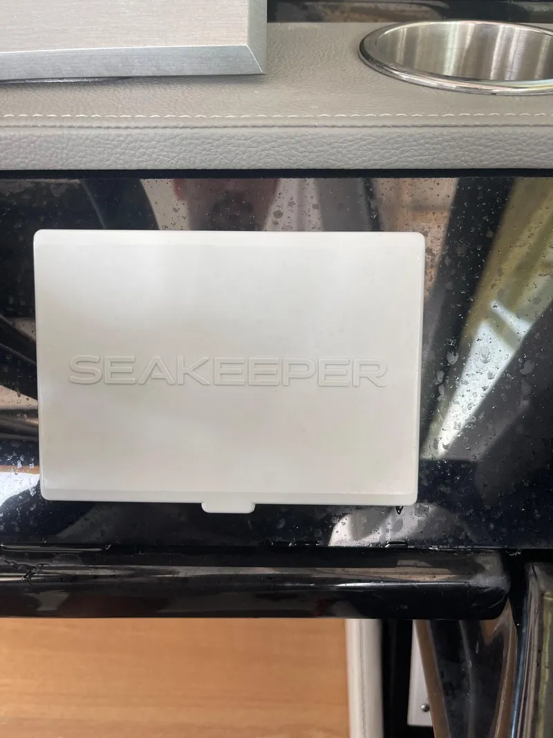 Slide: The Image of Control panel of a 2022 Sea Ray SLX 400 with Seakeeper system. - 23