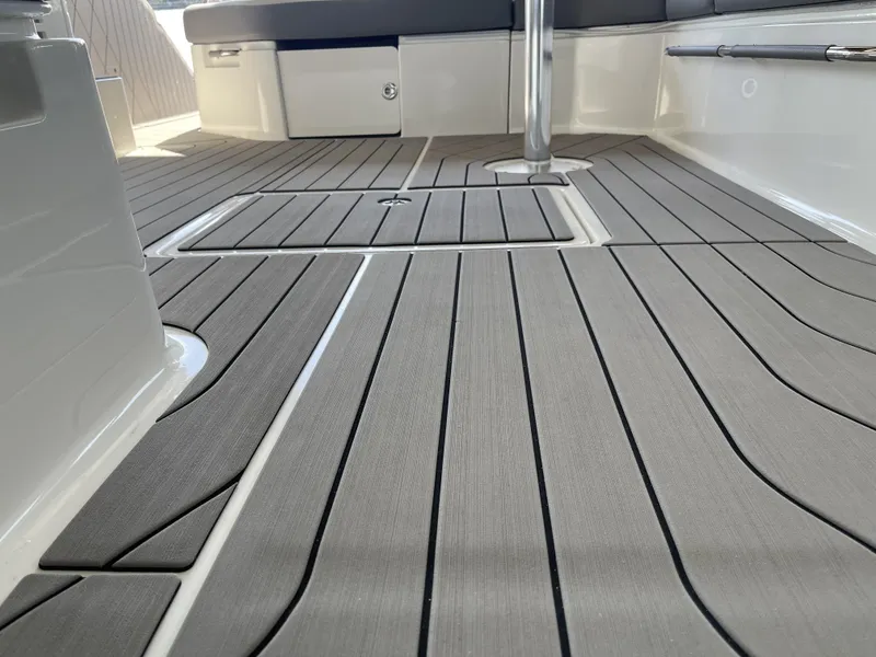 Slide: The Image of 2022 Sea Ray SLX 400 boat deck with sleek, modern design and comfortable seating. - 6