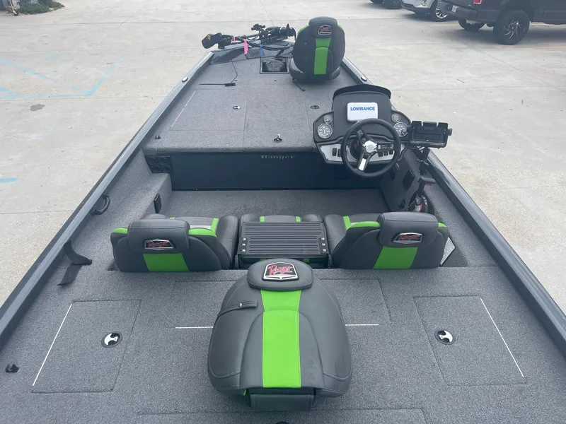 Slide: The Image of 2022 Ranger RT188 fishing boat with green and black seats and advanced navigation system. - 11