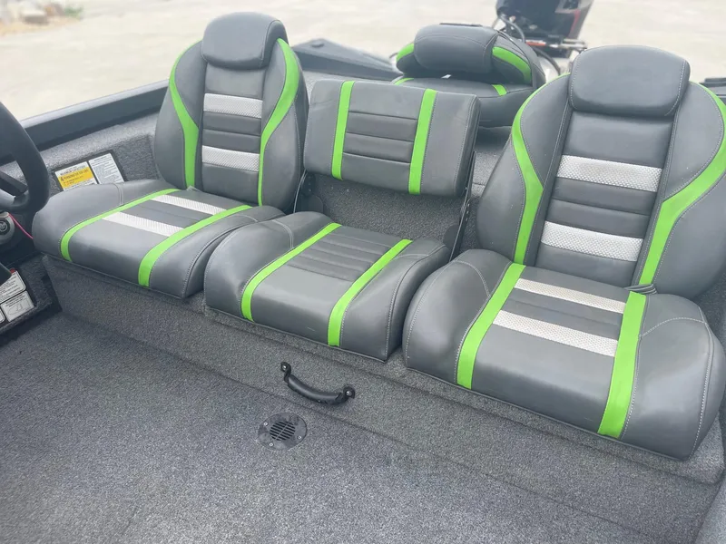Slide: The Image of 2022 Ranger RT188 boat interior with green and gray seats. - 15