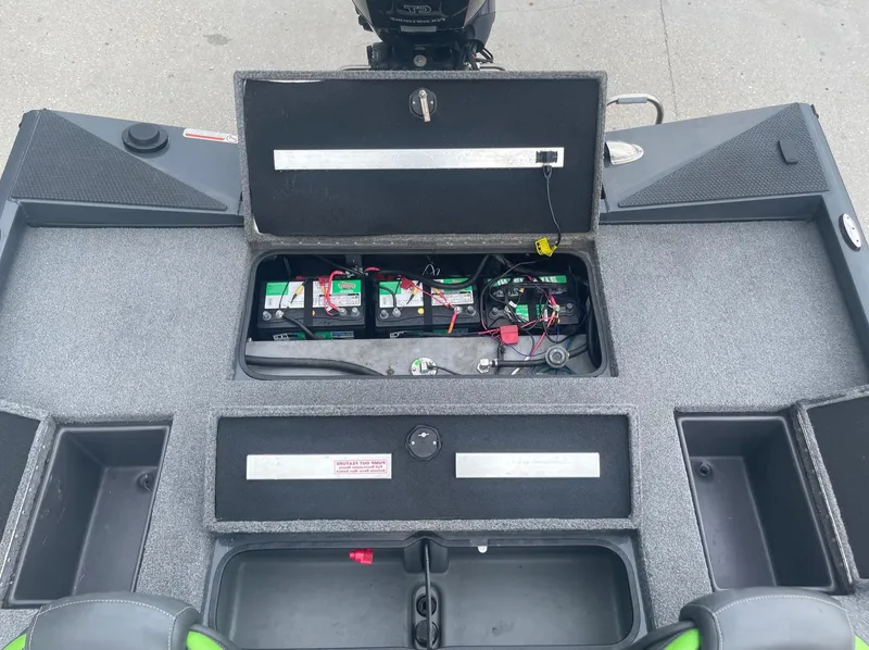 Slide: The Image of 2022 Ranger RT188 boat battery compartment with open storage hatch. - 17