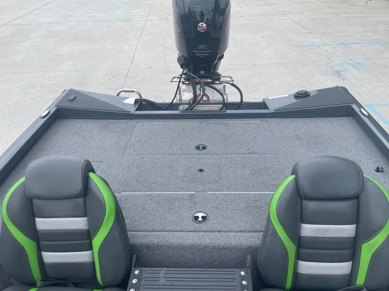 Slide: The Image of 2022 Ranger RT188 boat interior with green and black seats and outboard motor. - 18