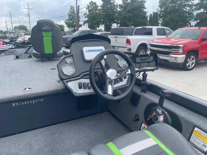 Slide: The Image of 2022 Ranger RT188 boat interior with steering wheel and Lowrance electronics. - 19