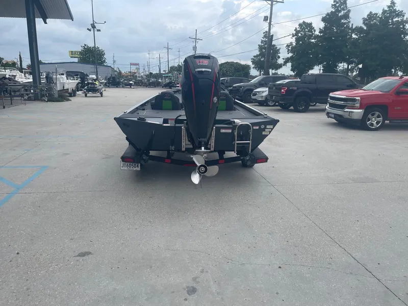 Slide: The Image of 2022 Ranger RT188 boat with outboard motor in parking lot. - 7
