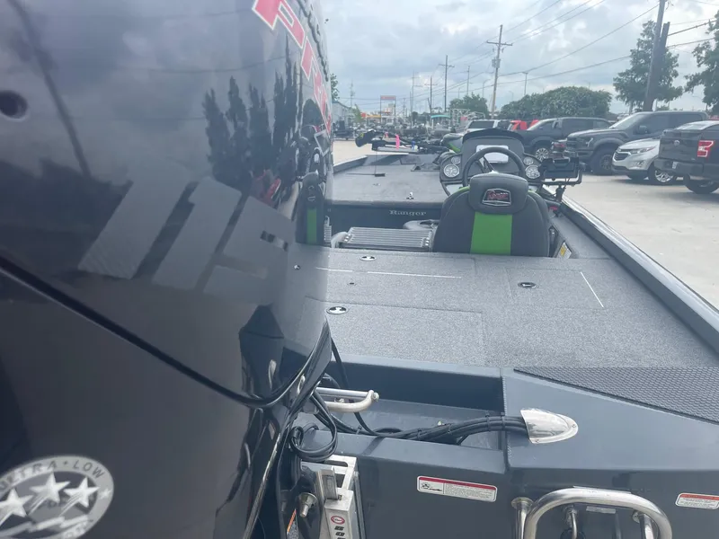 Slide: The Image of 2022 Ranger RT188 boat with motor, parked in a lot. - 8