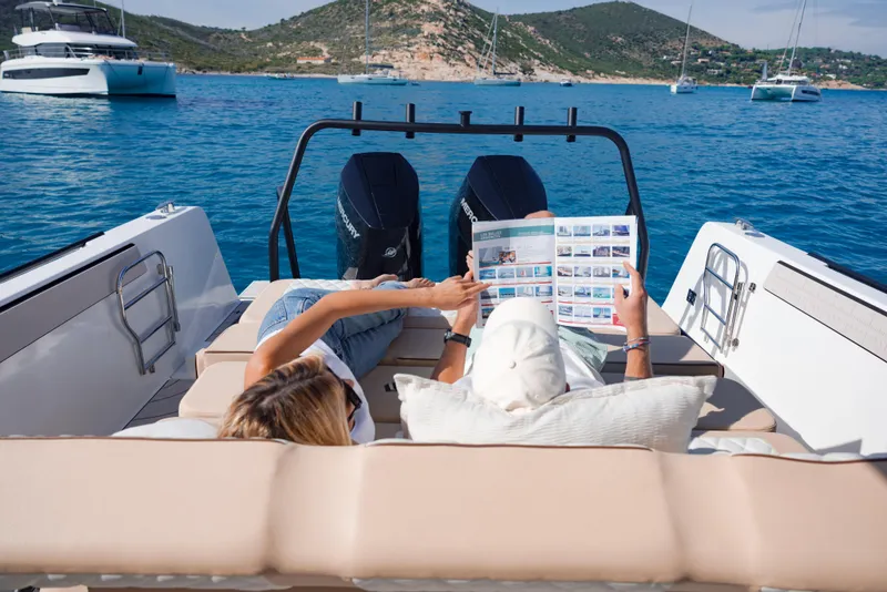 Slide: The Image of Couple relaxing on Zodiac X10CC boat, 2025 model, enjoying a scenic ocean view. - 10