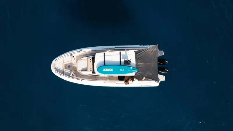 Slide: The Image of Aerial view of 2025 Zodiac X10CC boat on deep blue water. - 14