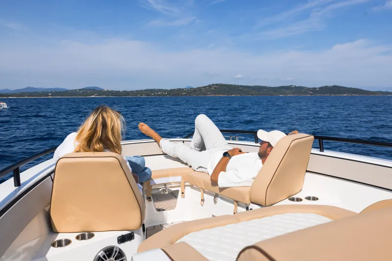 Slide: The Image of Couple relaxing on Zodiac X10CC boat, 2025 model, enjoying scenic ocean view. - 17